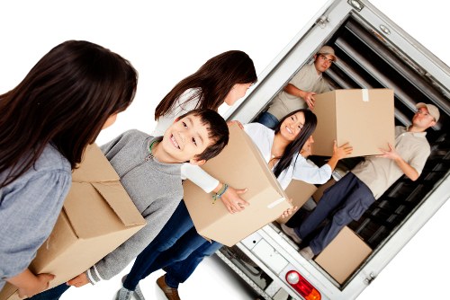 Removal van and moving team preparing a house move in Tooting