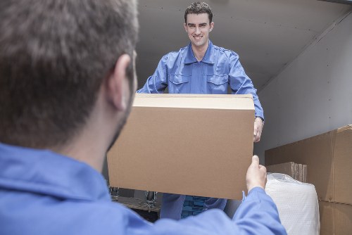 Removal van and moving boxes in a Tooting residential street