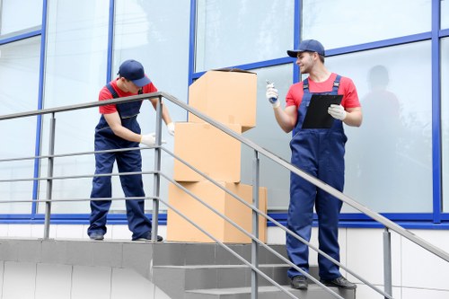 Professional movers loading furniture for a flat move in Tooting