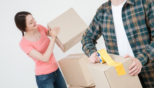 Professional movers handling office equipment in Tooting