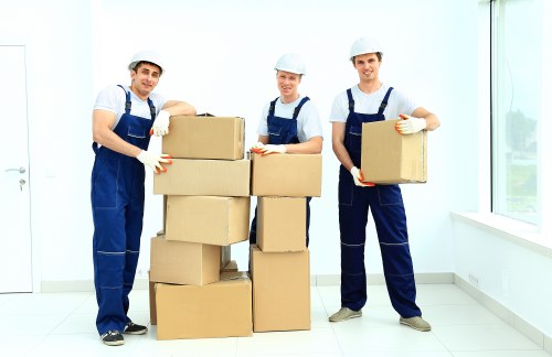 Removal team handling boxes safely during a Tooting move