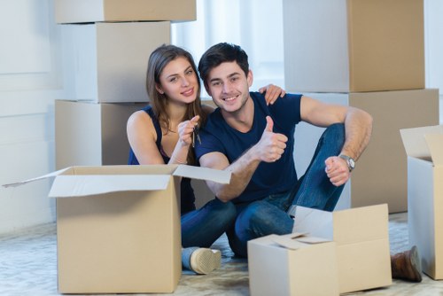 Packed office boxes and furniture ready for local removal