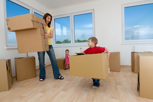 Movers protecting furniture and property while carrying items