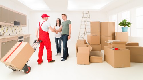 Careful unloading during a man with van removal service