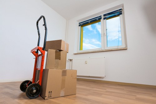 Local movers organising boxes during a packing service in Tooting