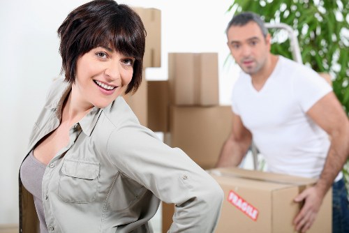 Professional movers unloading belongings at a Tooting home
