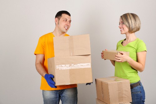 Careful unpacking of household items in a Tooting property