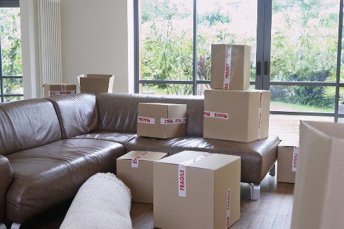 Loading boxes and furniture into a removals van in Tooting